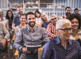 Celebrating diversity, diverse large meeting of employees